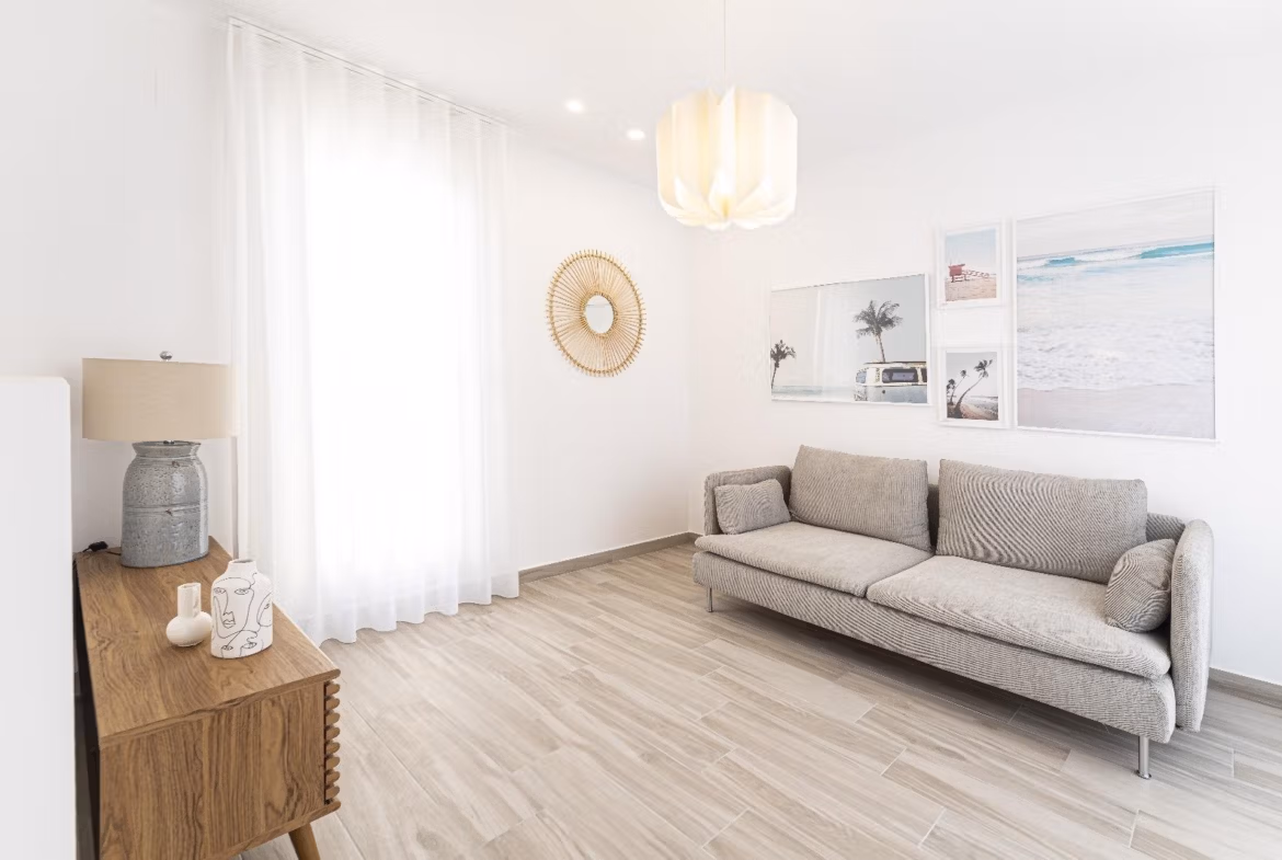 Bright, modern living room with natural light and coastal decor in a new 2-bedroom townhouse in La Manga del Mar Menor.