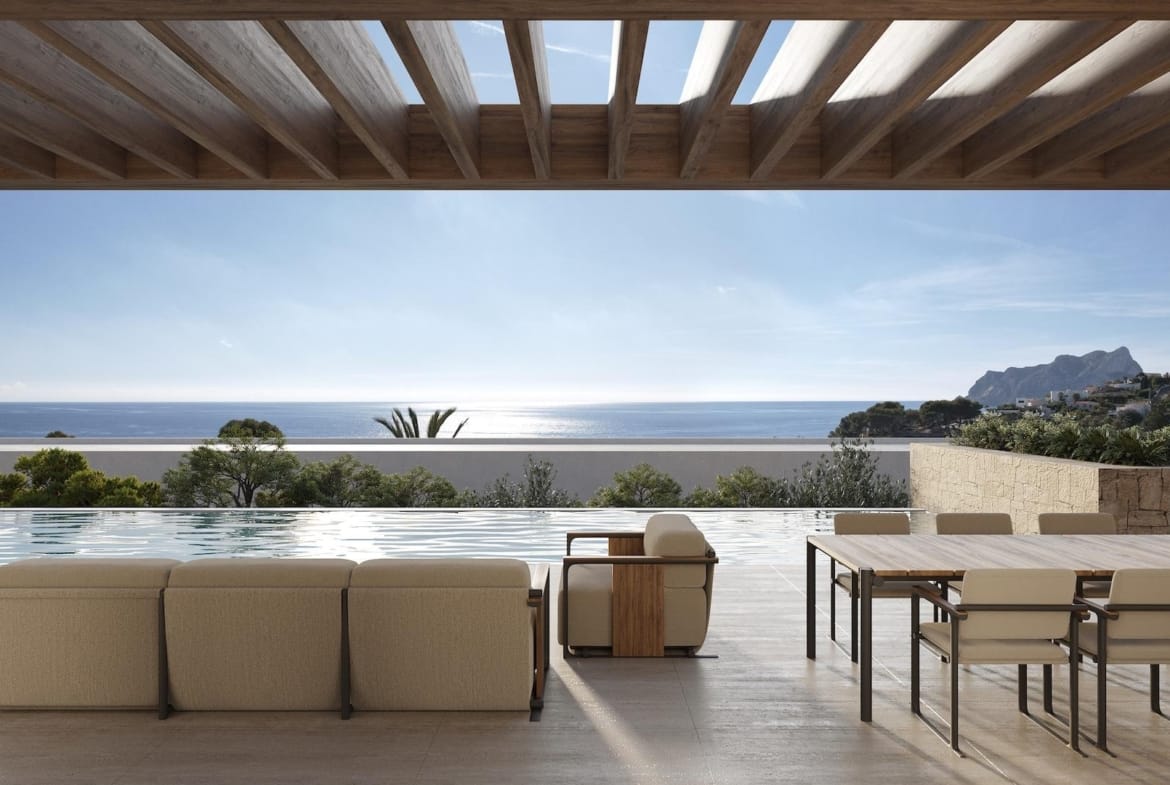 Sun-drenched terrace with modern seating, infinity pool, and panoramic sea views at architect-designed 4-bedroom villa in La Fustera, Benissa