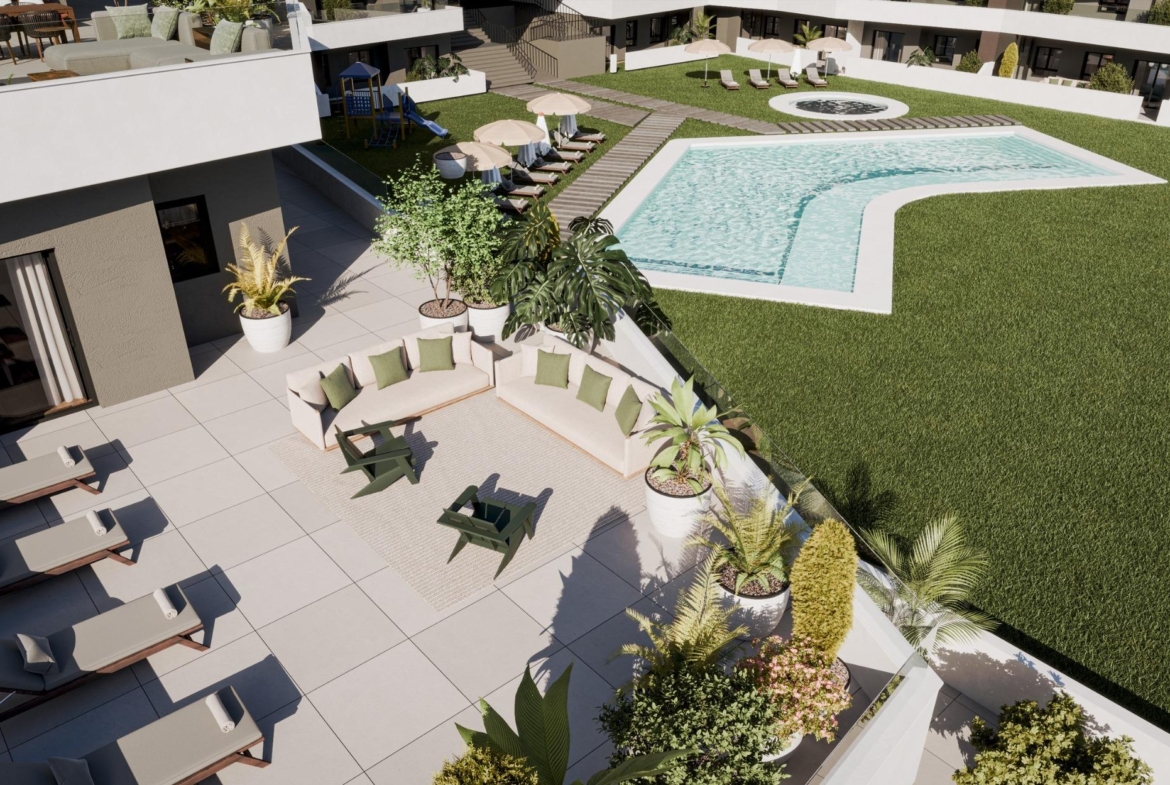 Spacious sun-drenched terrace with elegant outdoor seating overlooking landscaped pool in new build 2-bedroom ground floor apartment, San Miguel de Salinas