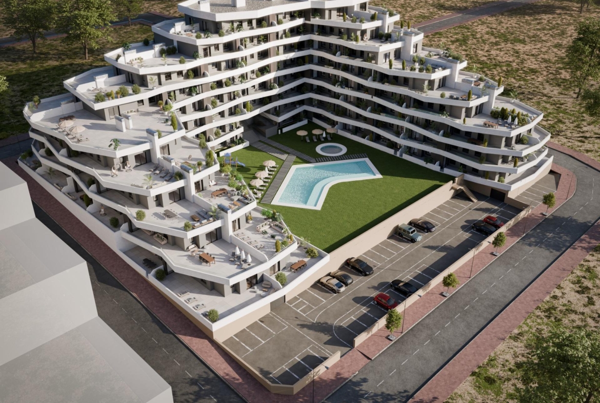 Modern luxury apartment complex with spacious terraces and sunlit communal pool in San Miguel de Salinas ground floor 2-bedroom unit.