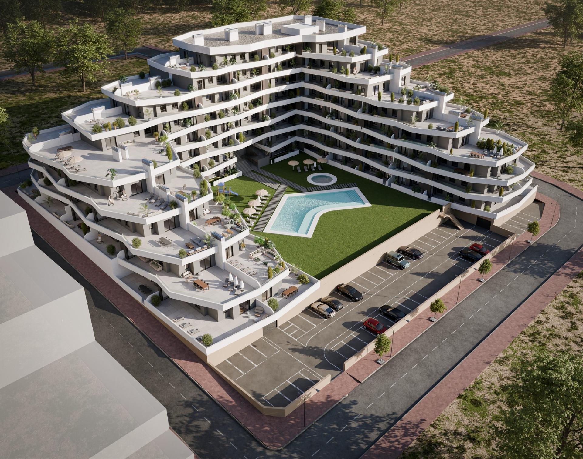 Modern luxury apartment complex with spacious terraces and sunlit communal pool in San Miguel de Salinas ground floor 2-bedroom unit.