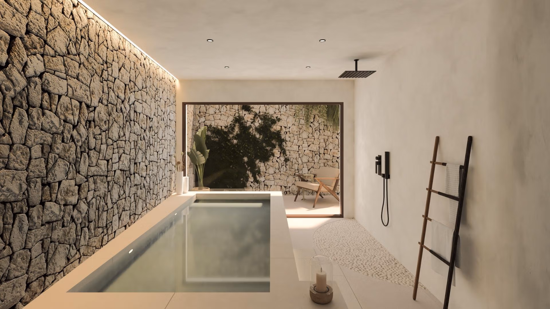 Modern indoor plunge pool with textured stone wall and calming natural light in a frontline 3-bedroom villa in Cabo de Palos