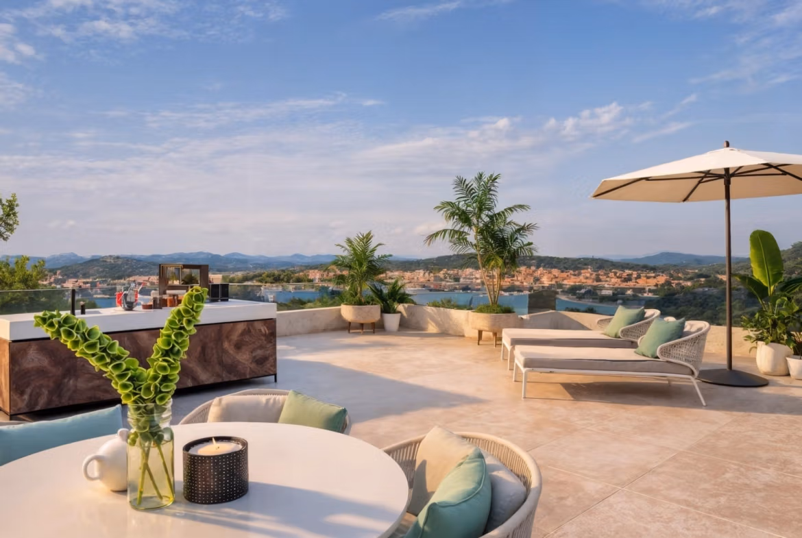 Spacious rooftop solarium with sun loungers, modern outdoor kitchen, and panoramic sea views at 3-bedroom villa in Cabo de Palos.