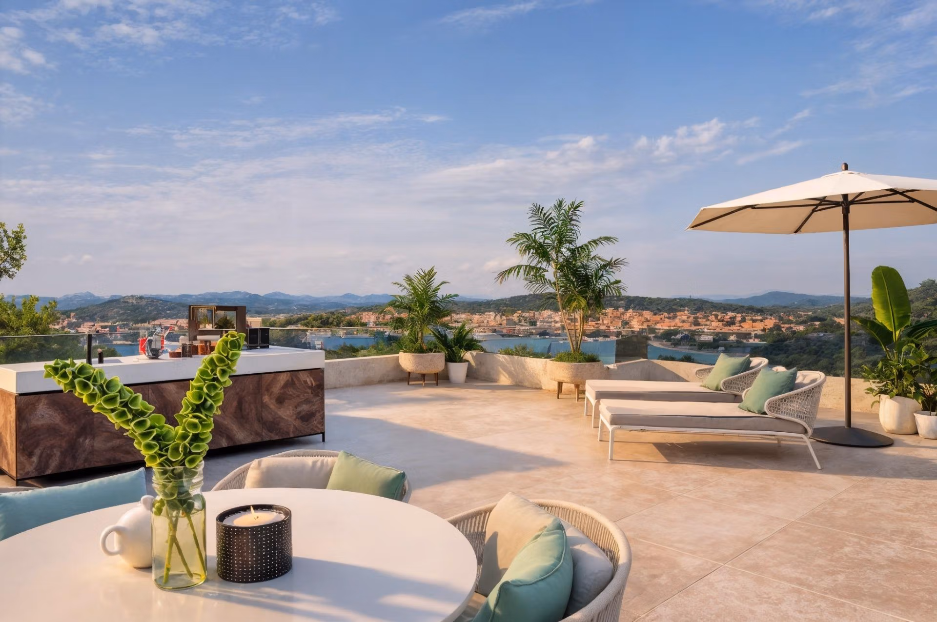 Spacious rooftop solarium with sun loungers, modern outdoor kitchen, and panoramic sea views at 3-bedroom villa in Cabo de Palos.