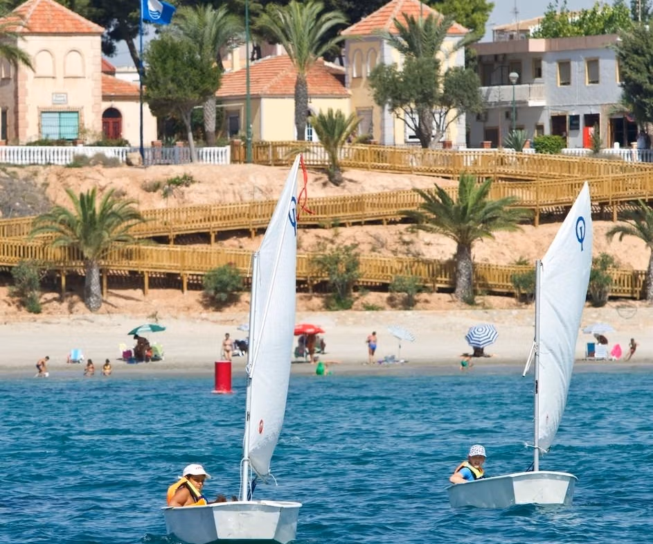 Bright coastal view with sailing boats and sandy beach near new build 3-bedroom ground floor apartment in Pilar de la Horadada
