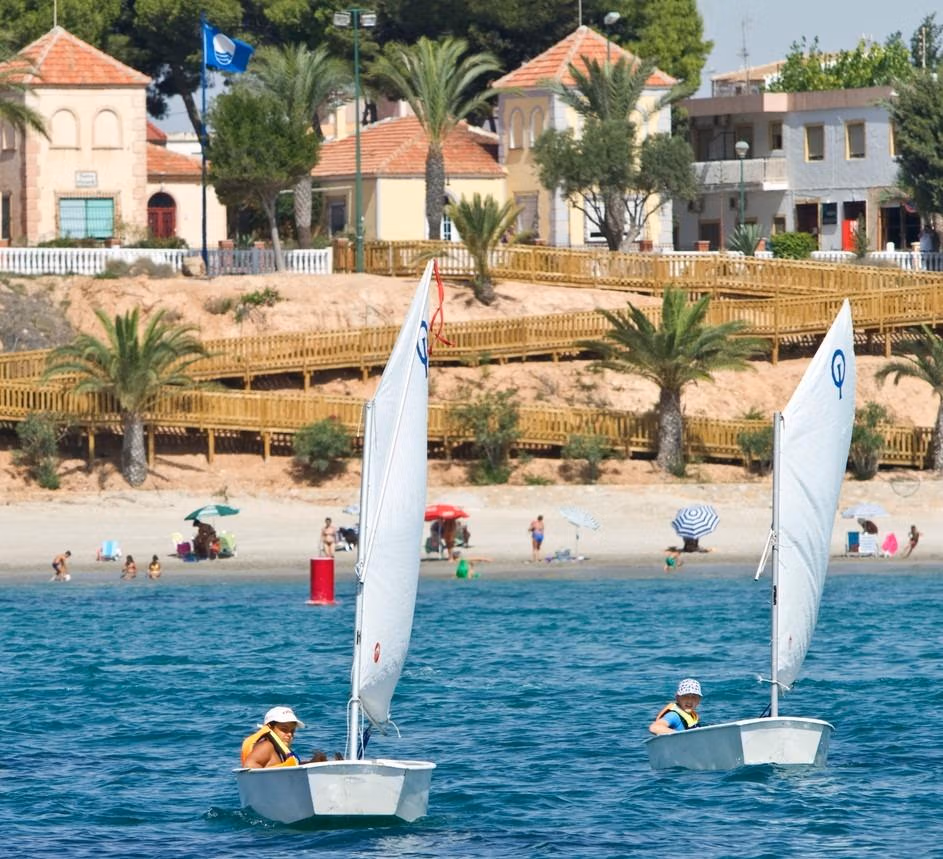 Bright coastal view with sailing boats and sandy beach near new build 3-bedroom ground floor apartment in Pilar de la Horadada