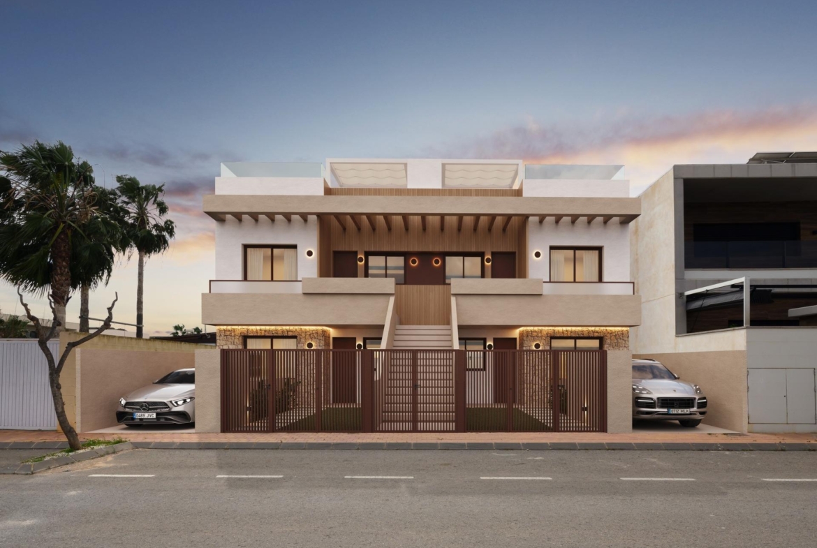 Elegant newly built bungalows with modern terraces and private parking in exclusive San Pedro del Pinatar neighborhood at sunset.
