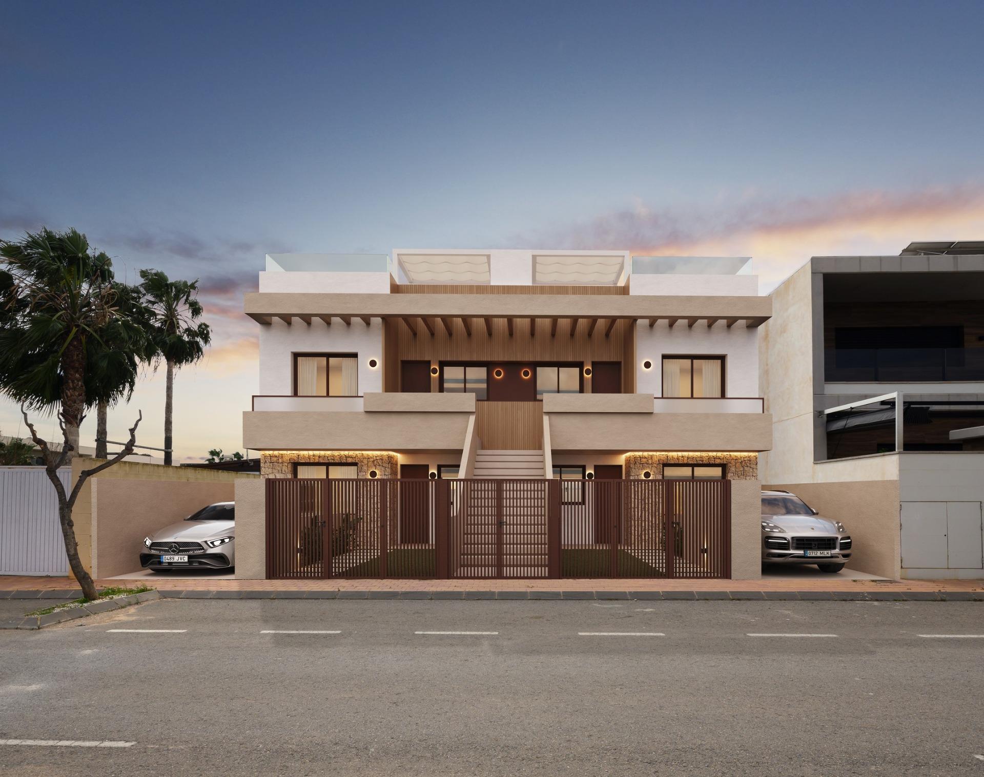 Elegant newly built bungalows with modern terraces and private parking in exclusive San Pedro del Pinatar neighborhood at sunset.