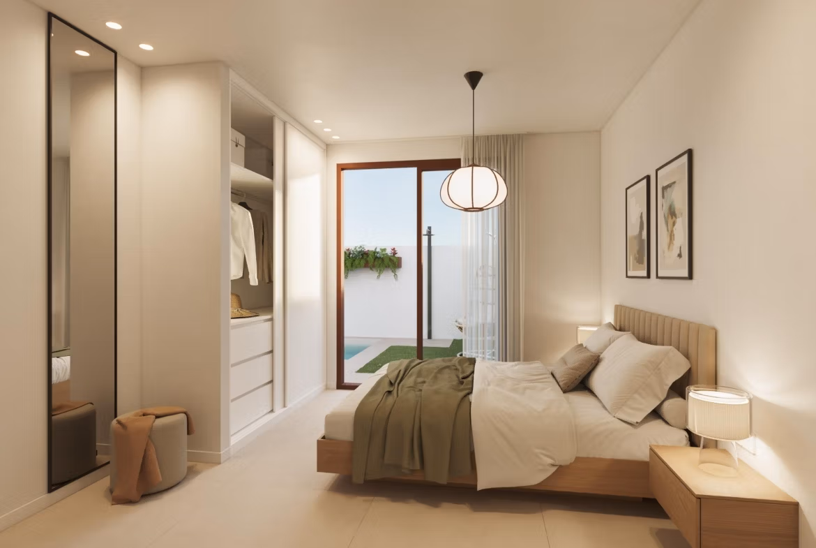 Bright, elegant bedroom in exclusive San Pedro del Pinatar bungalow with modern furnishings and access to a private sunlit terrace.