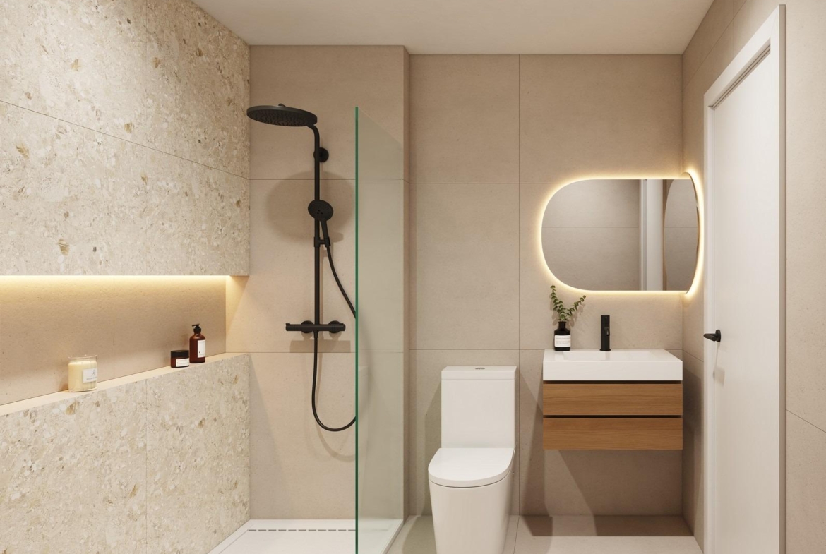 Modern, elegant bathroom with walk-in shower, illuminated vanity mirror, and sleek fixtures in new build bungalows San Pedro del Pinatar