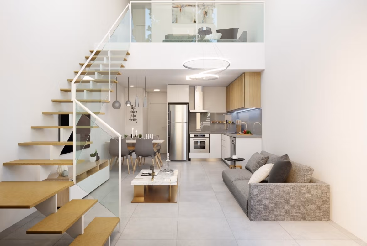 Bright modern interior of 2 bedroom townhouse in Orihuela Costa with open-plan kitchen, stylish living area, and floating staircase.