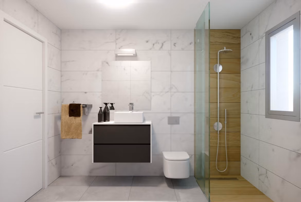 Bright modern bathroom with sleek floating vanity, glass-enclosed shower, and elegant marble tiles in Orihuela Costa townhouse.