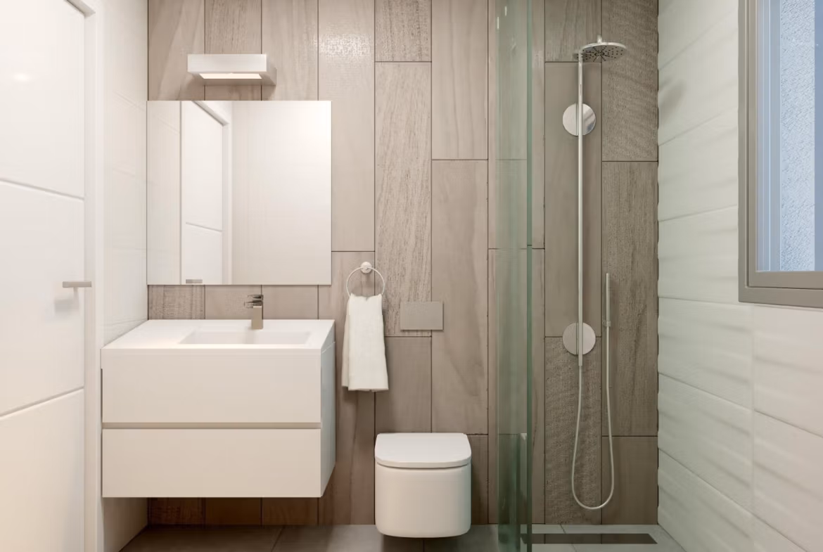 Bright modern bathroom with sleek fixtures and glass shower in a new 2-bedroom townhouse in Orihuela Costa near the beach