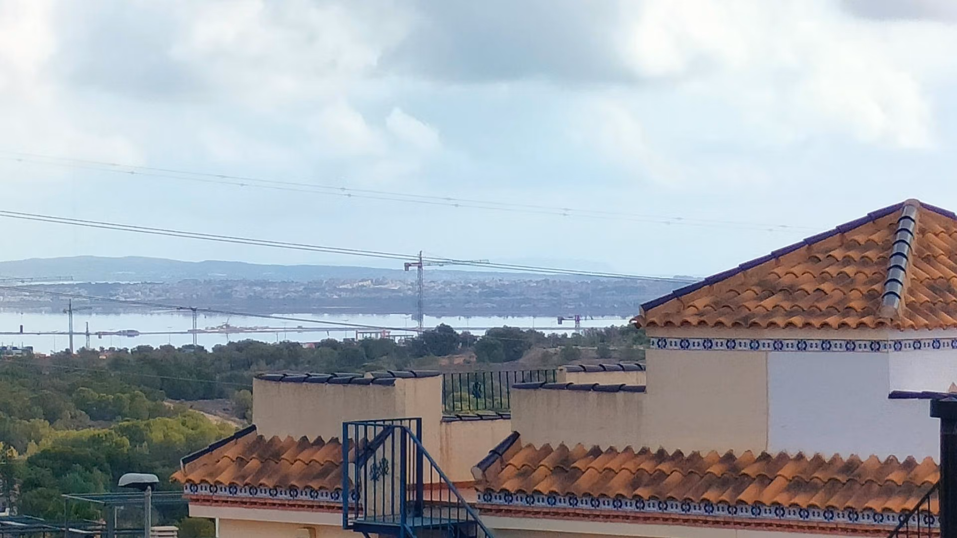 Terracotta-roofed modern 2-bedroom townhouse with spacious terraces and panoramic coastal views in Orihuela Costa near the beach.