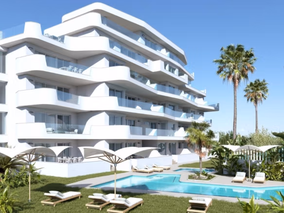 Modern stylish new build 2-bedroom tourist apartment in Mil Palmeras with spacious terraces and a landscaped pool area surrounded by palm trees.