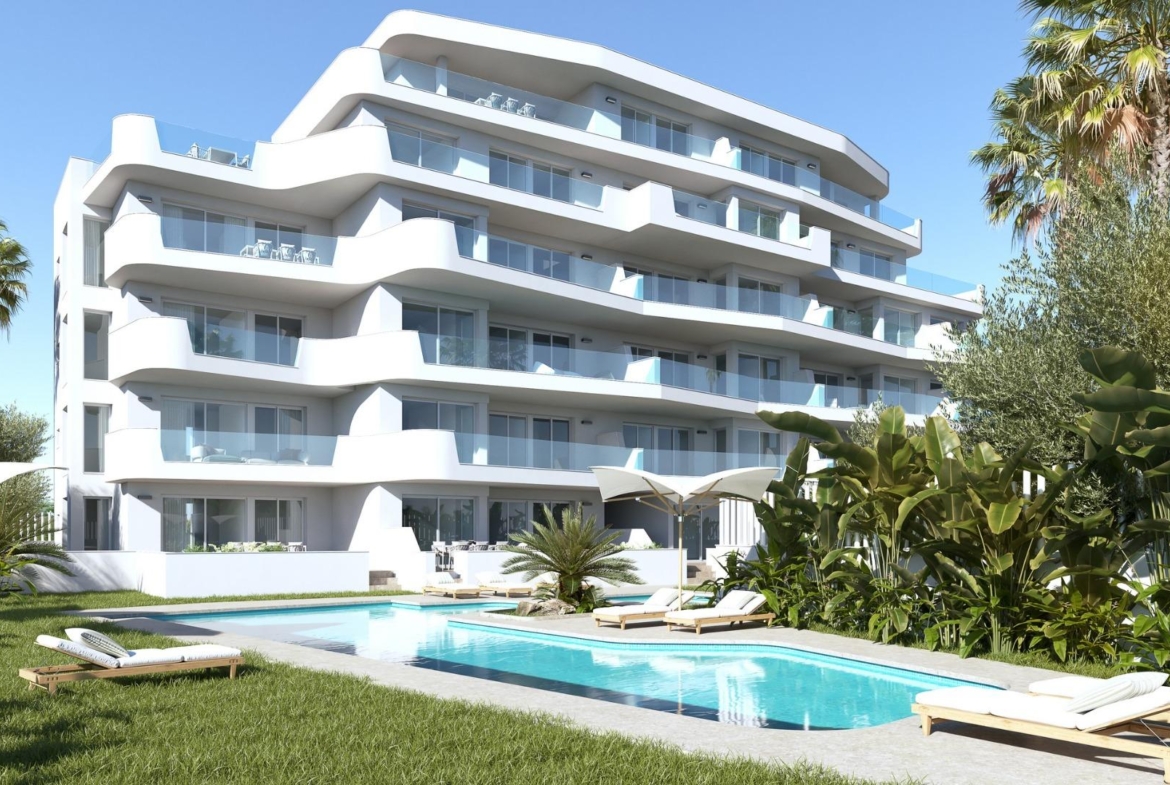 Modern white luxury 2-bedroom tourist apartment exterior in Mil Palmeras with sun-drenched terrace and private pool surrounded by lush greenery.