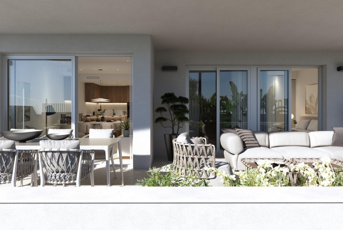 Sun-drenched elegant ground floor terrace with modern outdoor seating in exclusive 2-bedroom apartment in Mil Palmeras.