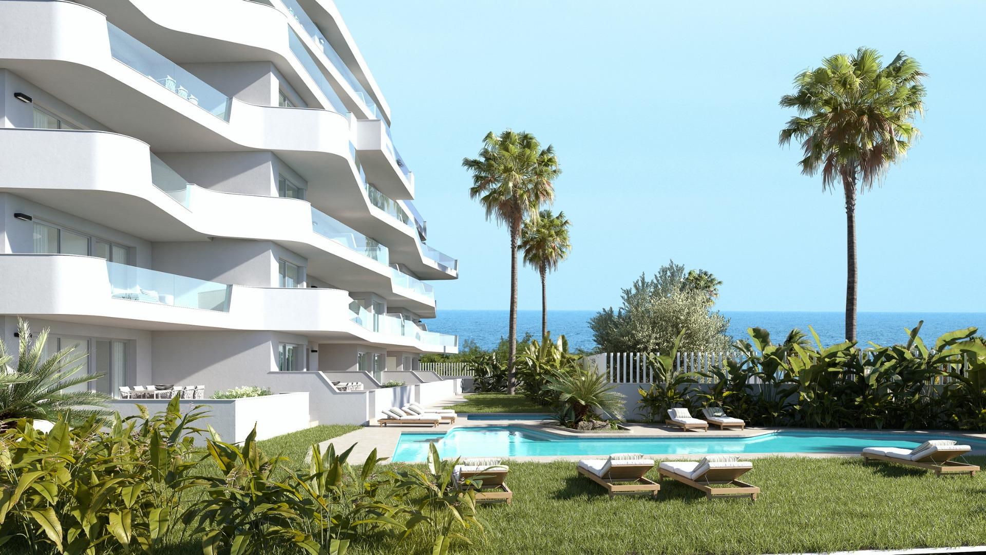 Modern luxury 2-bedroom penthouse in Mil Palmeras featuring a spacious pool area and panoramic sea views just 200m from the beach.