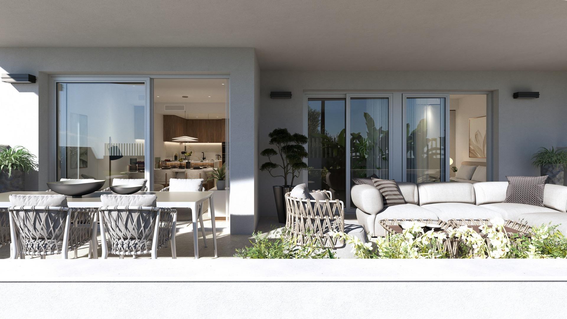 Spacious sun-drenched terrace with elegant outdoor seating in luxury 2-bedroom penthouse near Mil Palmeras seafront.