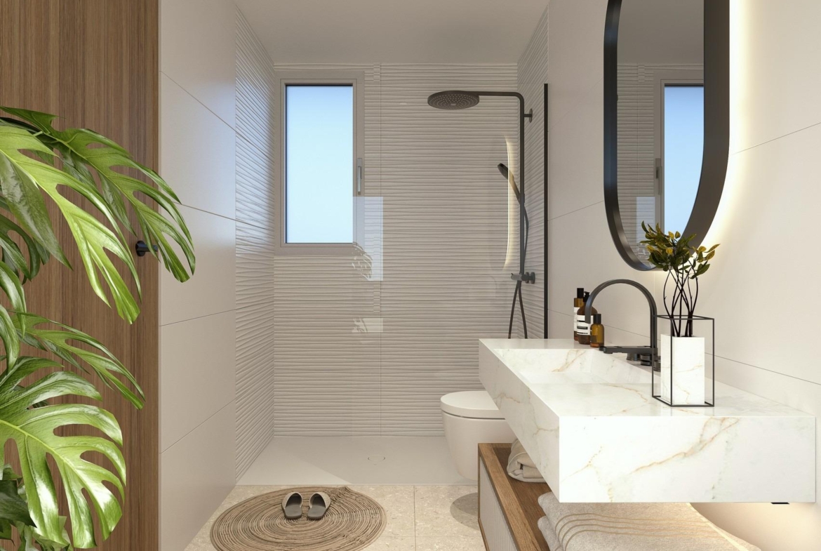 Modern luxury bathroom with marble countertop and sleek walk-in shower in 2 bedroom penthouse Mil Palmeras near sea