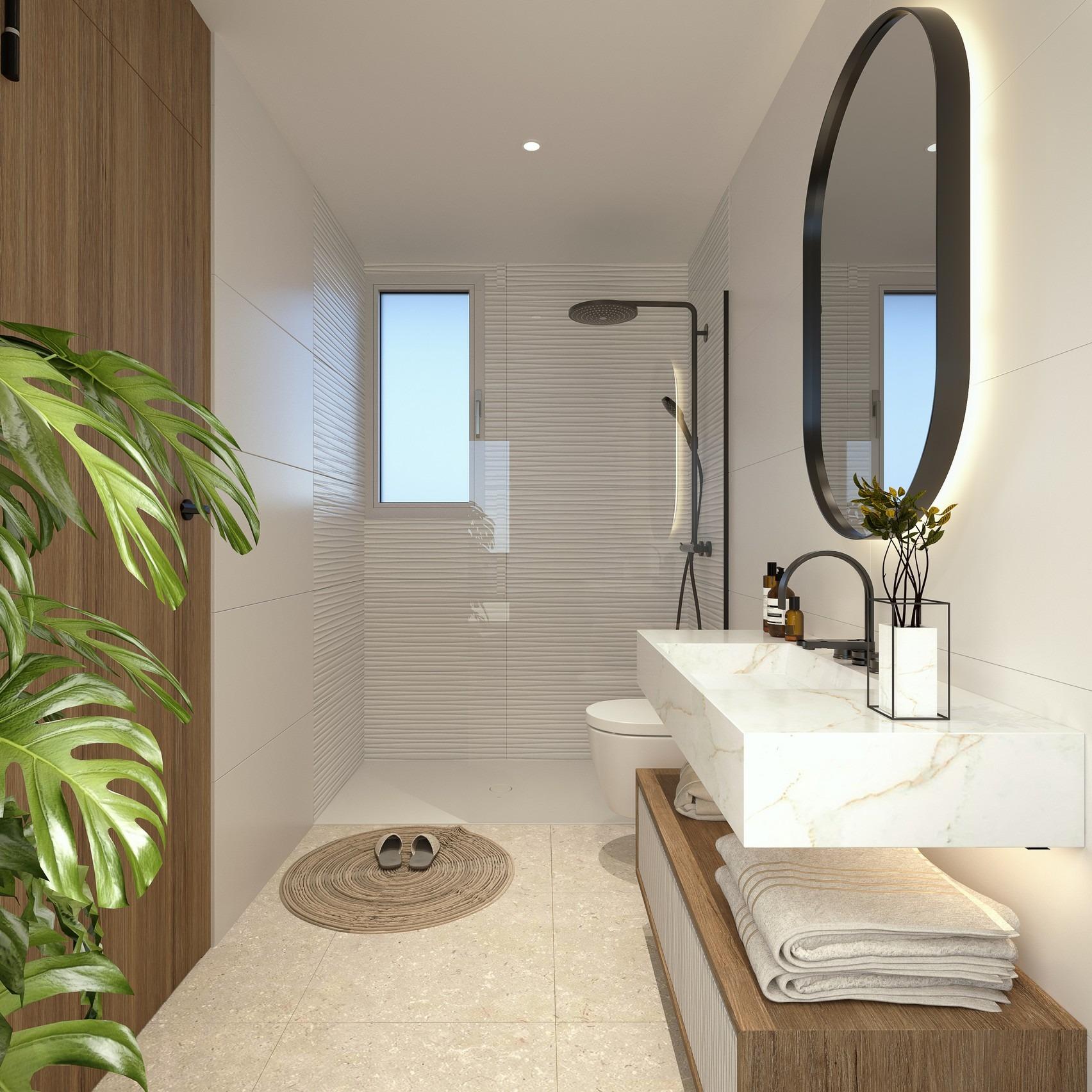 Modern luxury bathroom with marble countertop and sleek walk-in shower in 2 bedroom penthouse Mil Palmeras near sea