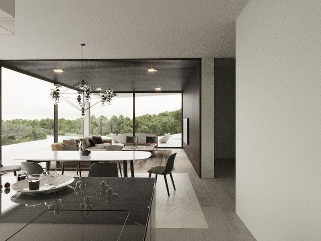LUXURY-NEW-BUILD-VILLA-IN-ALTEA-13 Bright open-plan living and dining area with sleek black kitchen in luxury new build villa in Altea, surrounded by lush greenery.