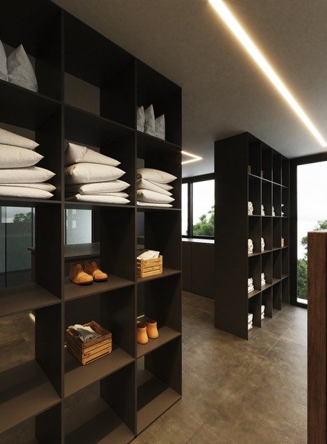 LUXURY-NEW-BUILD-VILLA-IN-ALTEA-17 Spacious modern walk-in closet with sleek black shelving and natural light in luxury new build villa in Altea