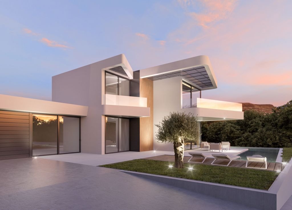 LUXURY-NEW-BUILD-VILLA-IN-ALTEA-28 Modern luxury new build villa in Altea with sleek exterior, illuminated landscaping, private pool, and serene sunset backdrop.
