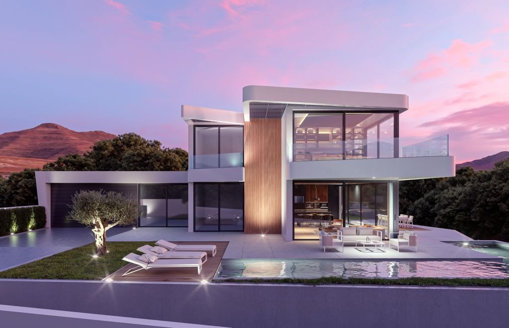 LUXURY NEW BUILD VILLA IN ALTEA Stunning modern luxury new build villa in Altea with sleek glass facades, illuminated pool, spacious terrace, and mountain backdrop at sunset