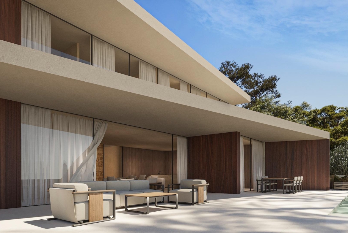 Modern architectural 4-bedroom villa exterior in Benissa showcasing spacious terraces with elegant outdoor seating and natural wood accents.