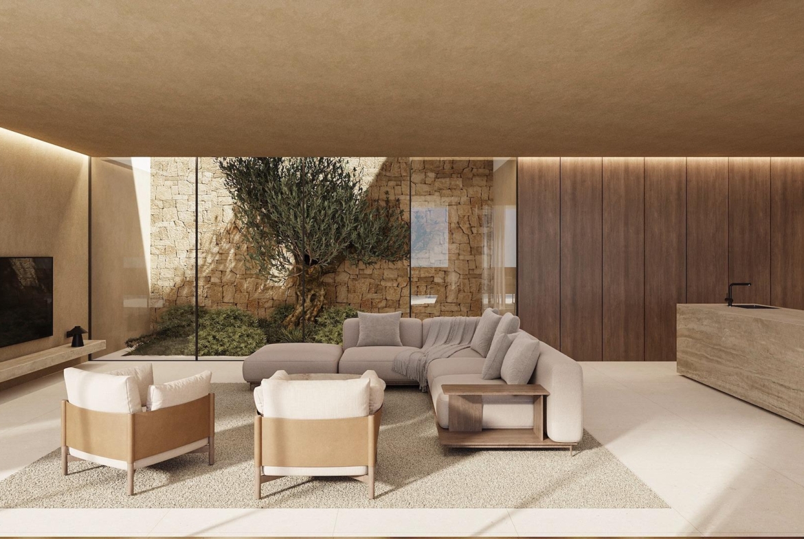 Elegant sunlit living room with modern furnishings and indoor garden in a luxury 4 bedroom villa in Benissa.