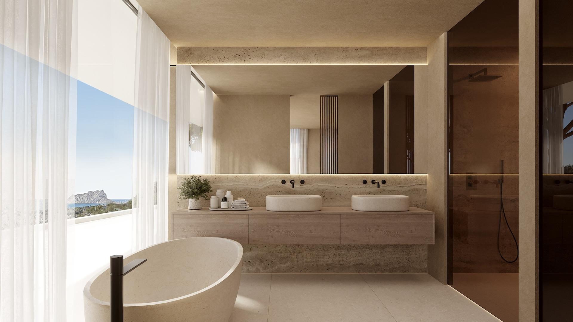 Bright, modern bathroom with freestanding tub, double sinks, sleek finishes, and panoramic sea views in Benissa luxury villa.