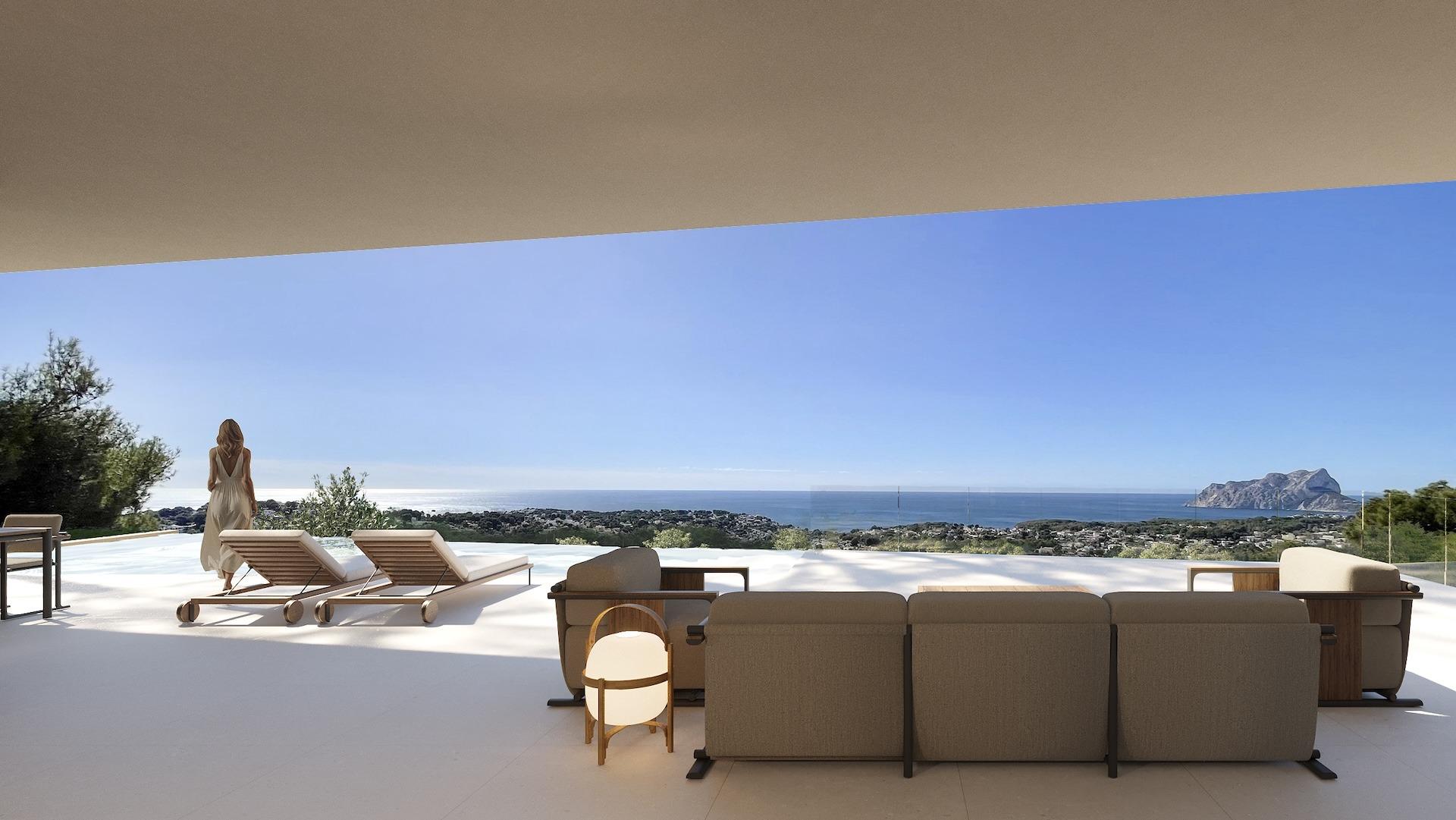Modern architectural villa terrace в Benissa with elegant outdoor seating, sun loungers, и панорамна гледка към морето under a clear sky.