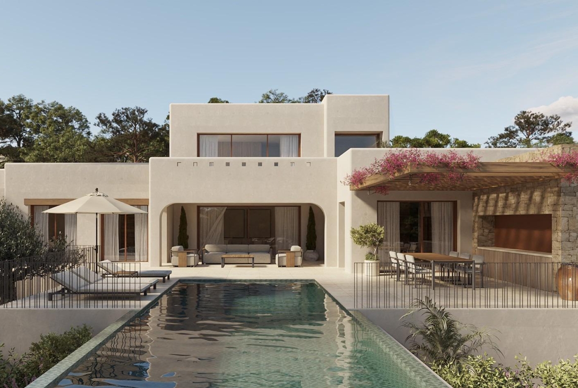 Elegant Ibizan-style villa exterior in La Fustera, Benissa with spacious terrace, shaded dining area, and tranquil infinity pool.