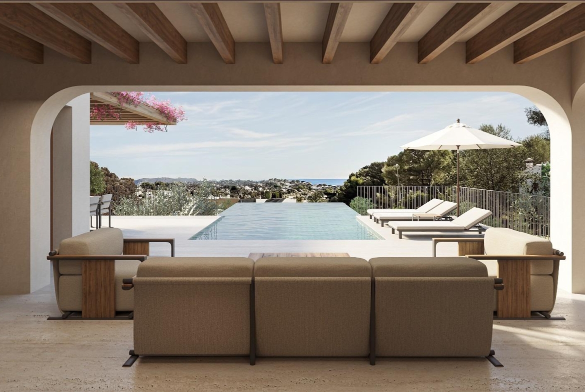 Sun-drenched covered terrace with modern seating overlooking infinity pool and panoramic sea views at Ibizan-style villa in La Fustera, Benissa