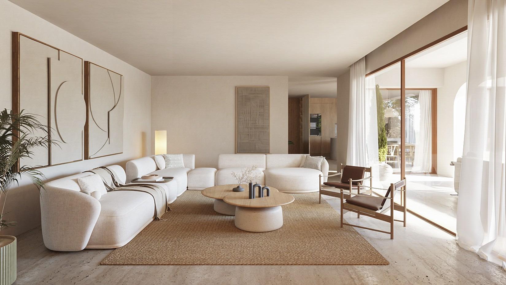 Sun-drenched, elegant living room with curved sofa and natural textures in new Ibizan-style villa in La Fustera, Benissa