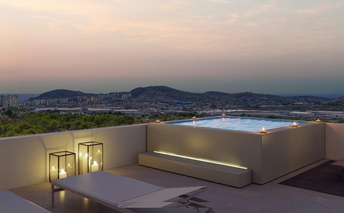 Sunset view of a sleek rooftop terrace with an illuminated jacuzzi and loungers in a modern 3-bedroom apartment, Sierra Cortina, Finestrat.