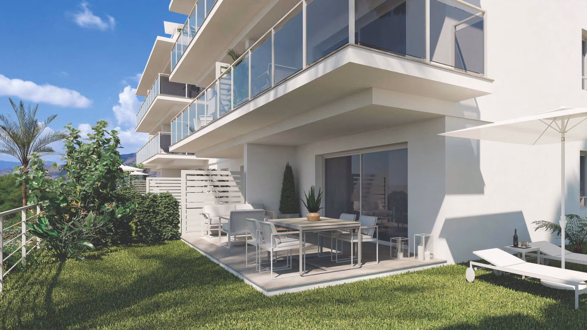 Luxury-New-Build-Apartments-and-Townhouses-in-Sierra-Cortina-Resort-18 Modern spacious 3-bedroom apartment terrace and garden with sunlit lounge chairs in luxury Sierra Cortina, Finestrat development.