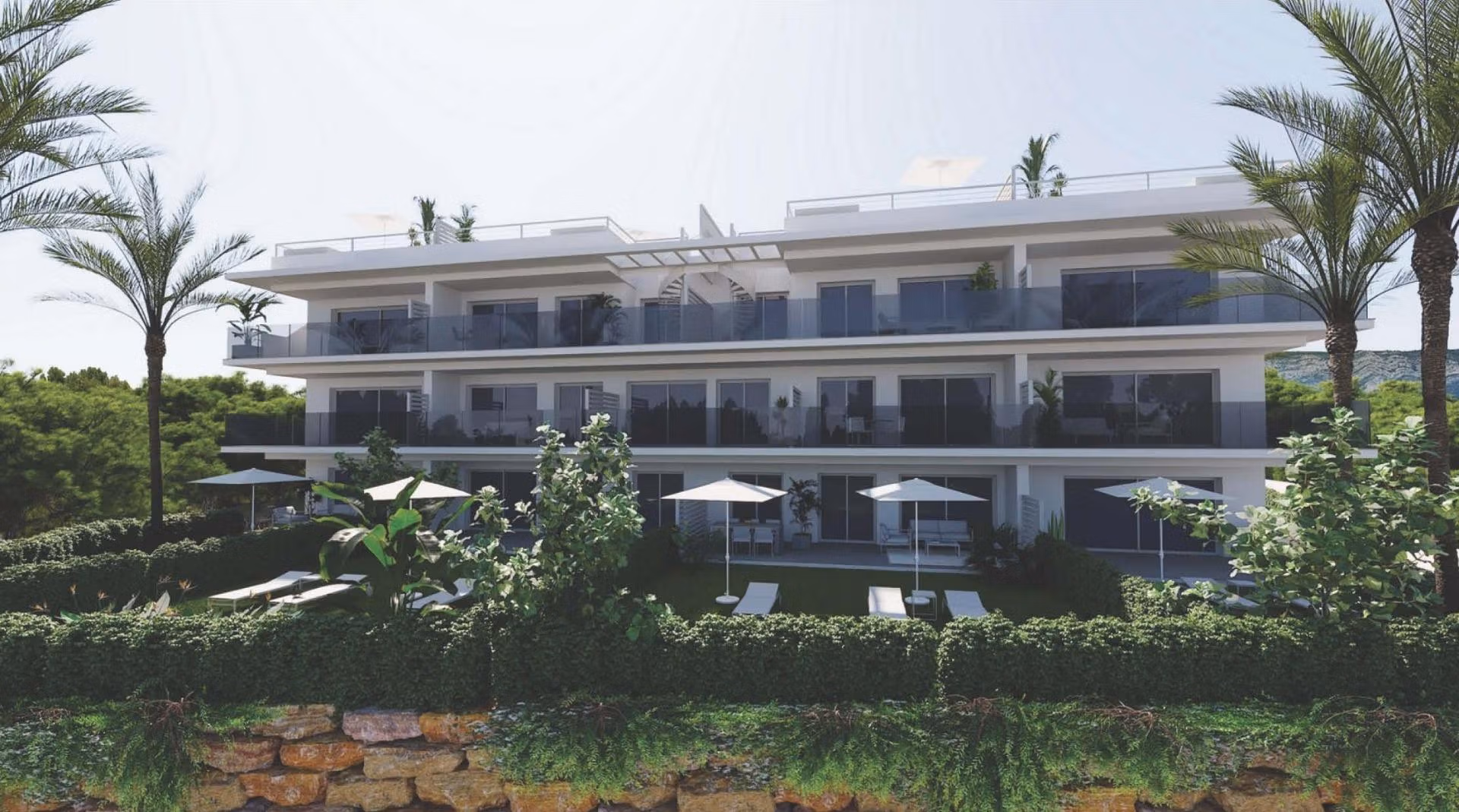 Luxury-New-Build-Apartments-and-Townhouses-in-Sierra-Cortina-Resort-2 Modern spacious 3-bedroom apartment exterior with large terraces and lush landscaping in Sierra Cortina, Finestrat.