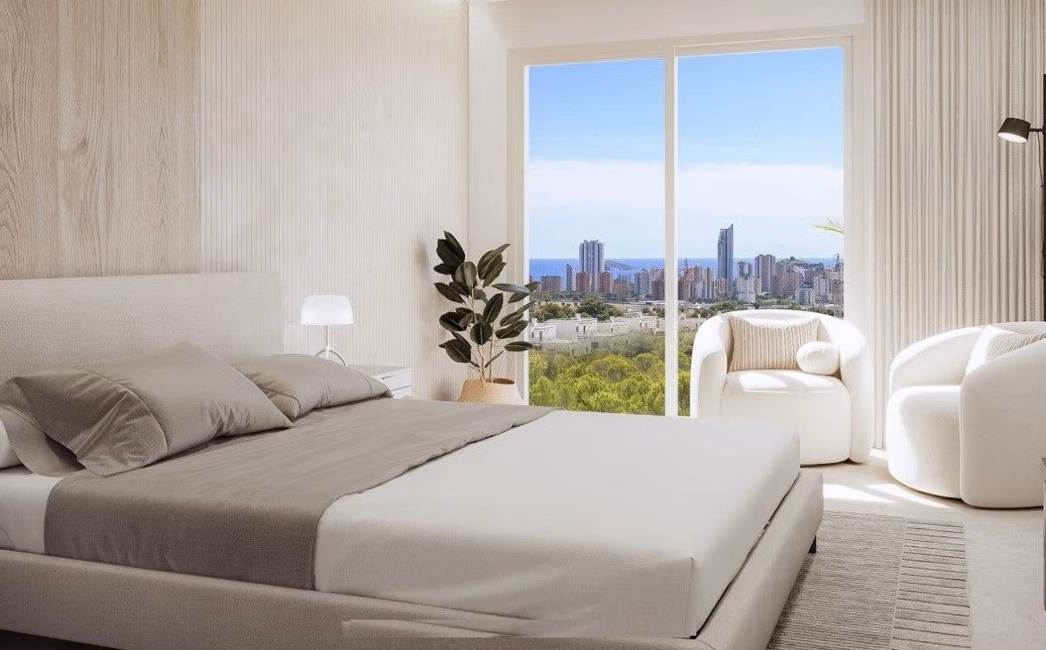 Bright modern bedroom with panoramic city and sea views in spacious 3-bedroom apartment at Sierra Cortina, Finestrat.
