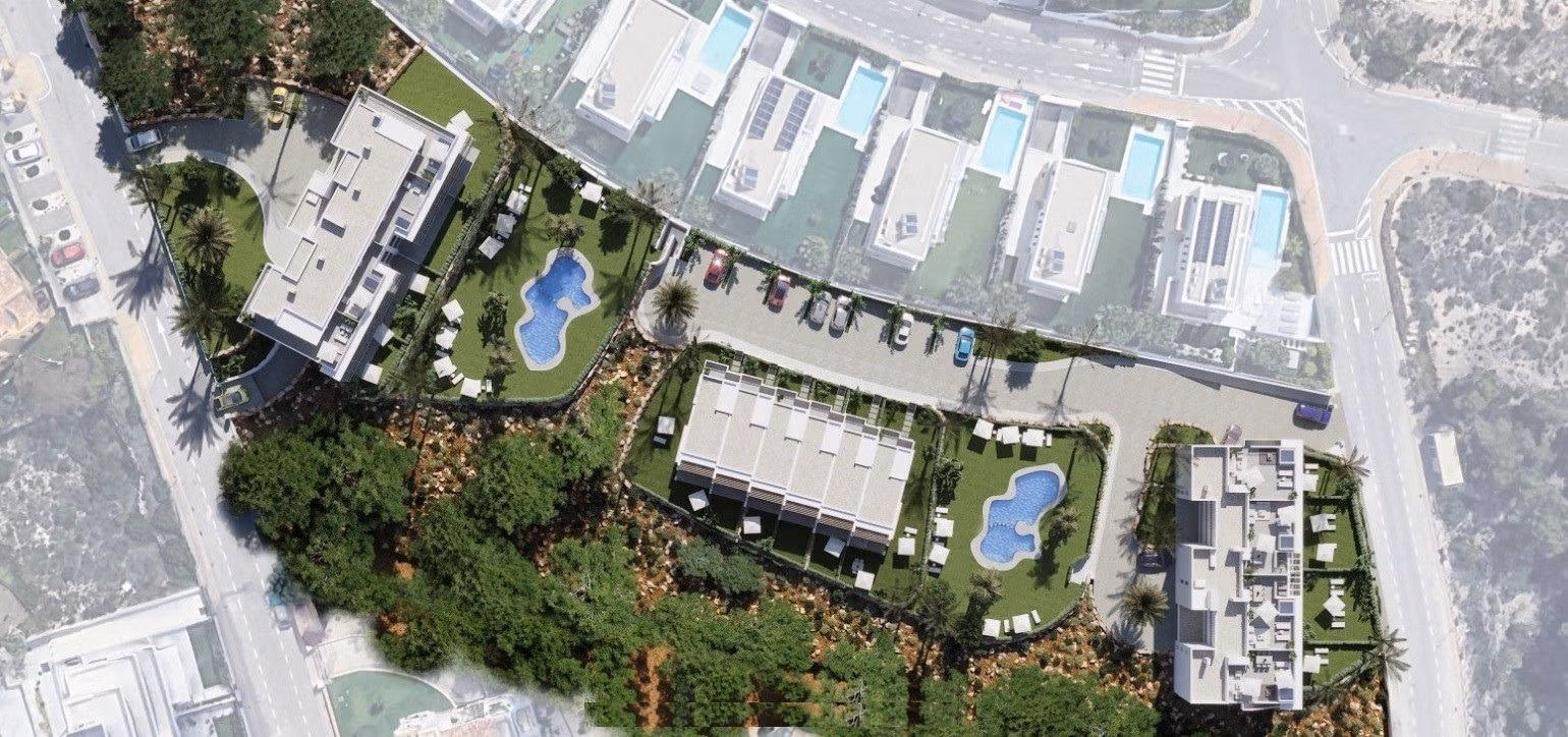 Luxury-New-Build-Apartments-and-Townhouses-in-Sierra-Cortina-Resort-8 Aerial view of spacious new build 3-bedroom apartment complex in Sierra Cortina, Finestrat with landscaped gardens and blue communal pools.