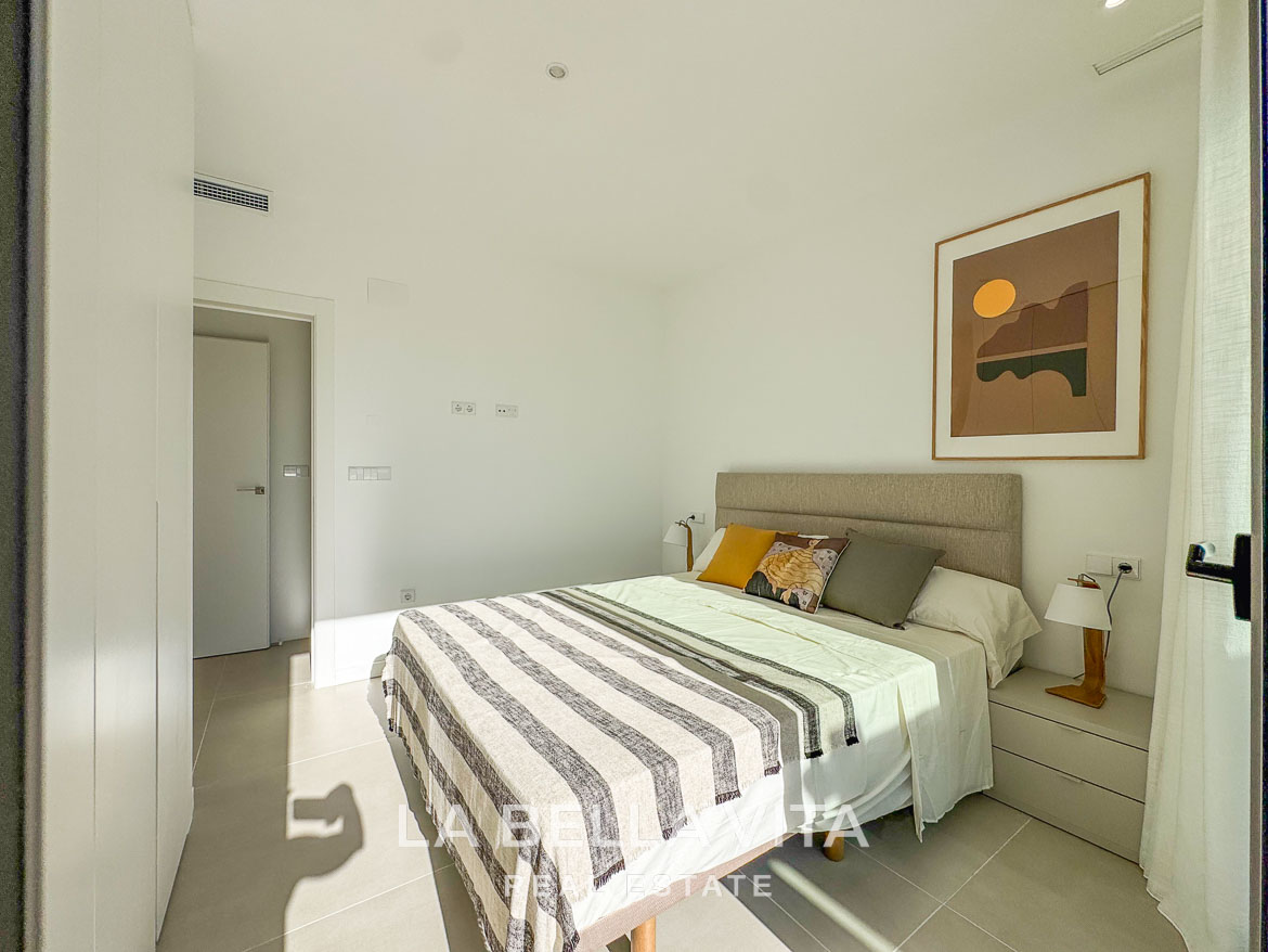Bright, modern bedroom with minimalist decor in a new build 3 bedroom villa in Pinar de Campoverde