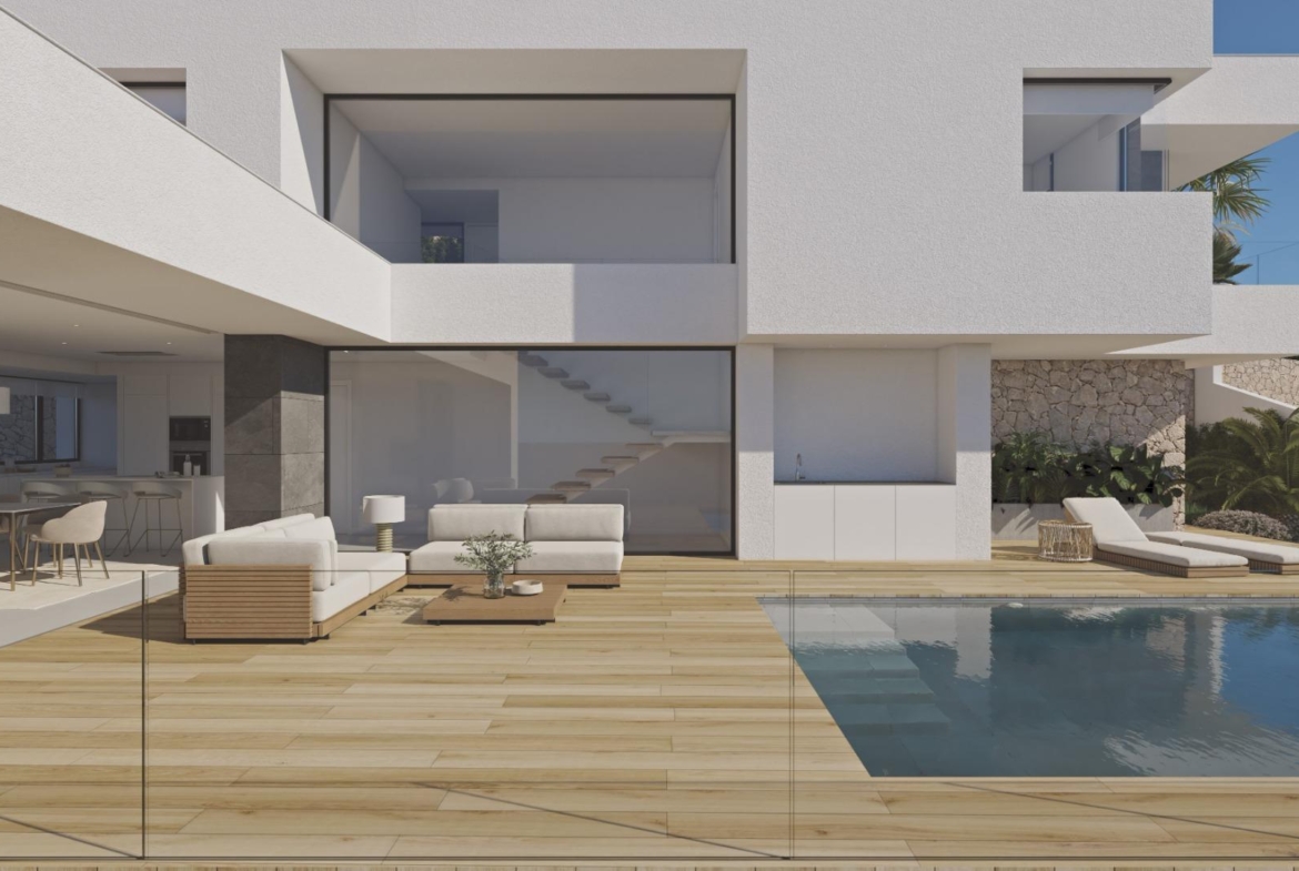 Modern luxury villa in Cumbre del Sol with spacious sun-drenched terrace, infinity pool, and elegant open-plan living area.
