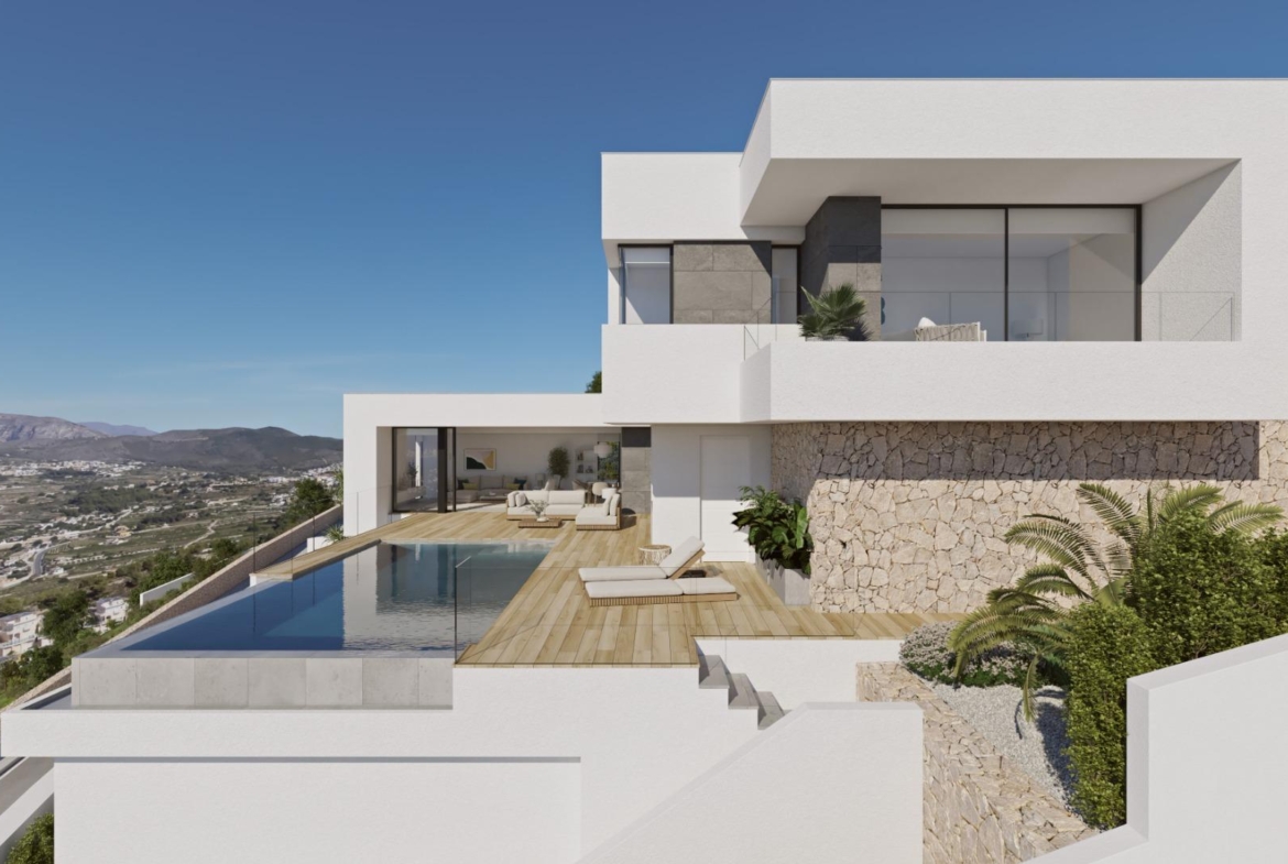 Modern luxury villa in Cumbre del Sol with spacious sun-drenched terrace, infinity pool, and panoramic sea and mountain views