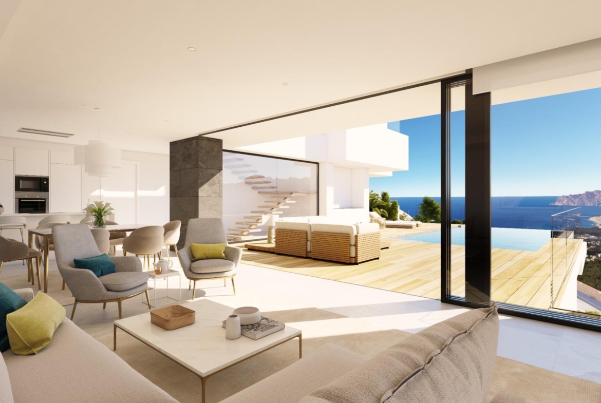 Bright open-plan living area with elegant seating flowing to a sun-drenched terrace and infinity pool in luxury villa at Cumbre del Sol with panoramic sea views