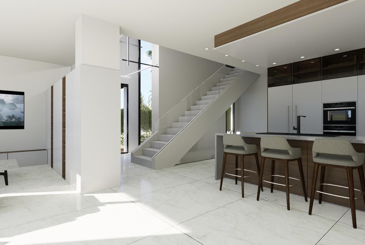 Bright, modern open-plan kitchen and living area with sleek finishes and elegant staircase in luxury 4-bedroom villa, La Zenia, Orihuela Costa