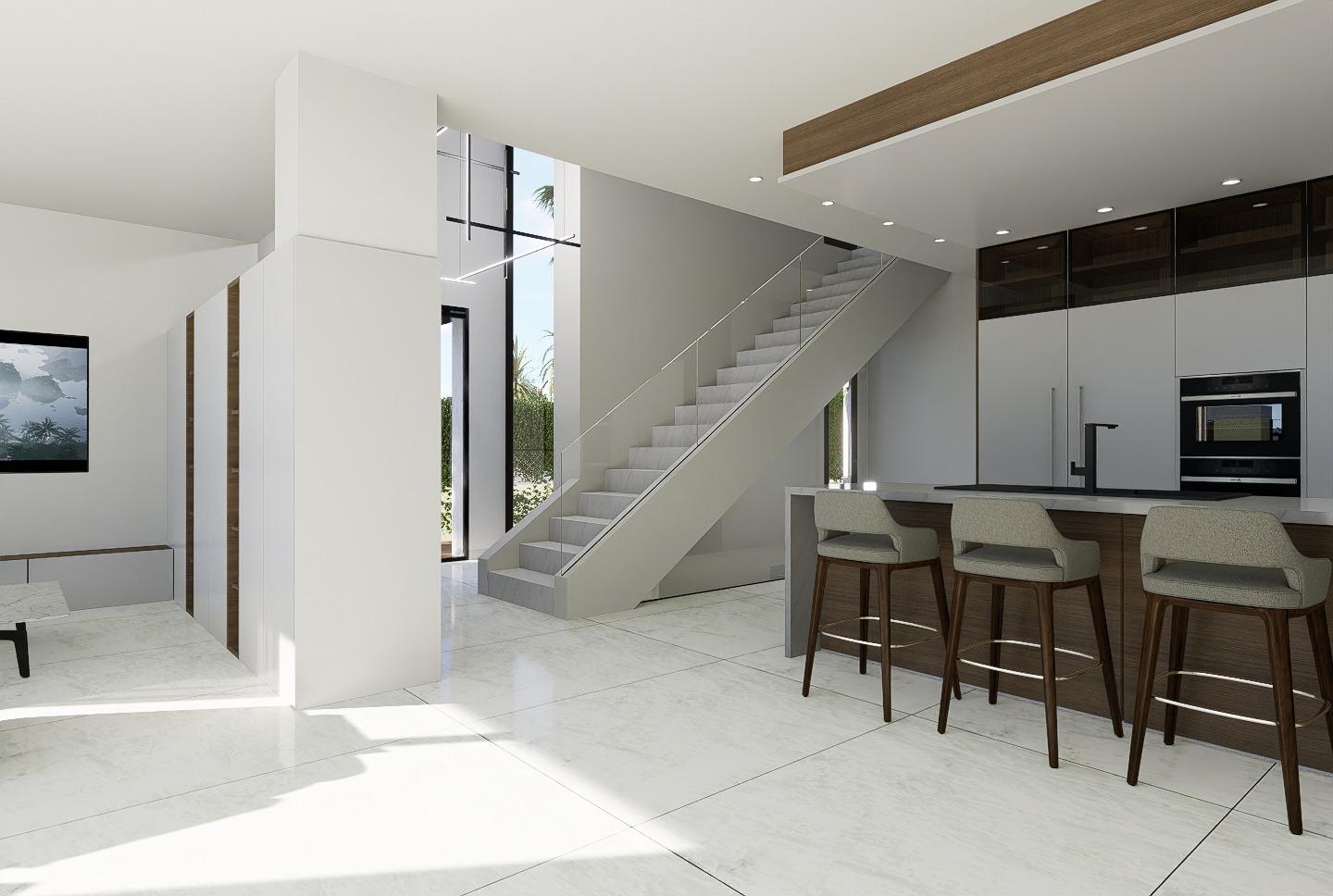 Bright, modern open-plan kitchen and living area with sleek finishes and elegant staircase in luxury 4-bedroom villa, La Zenia, Orihuela Costa