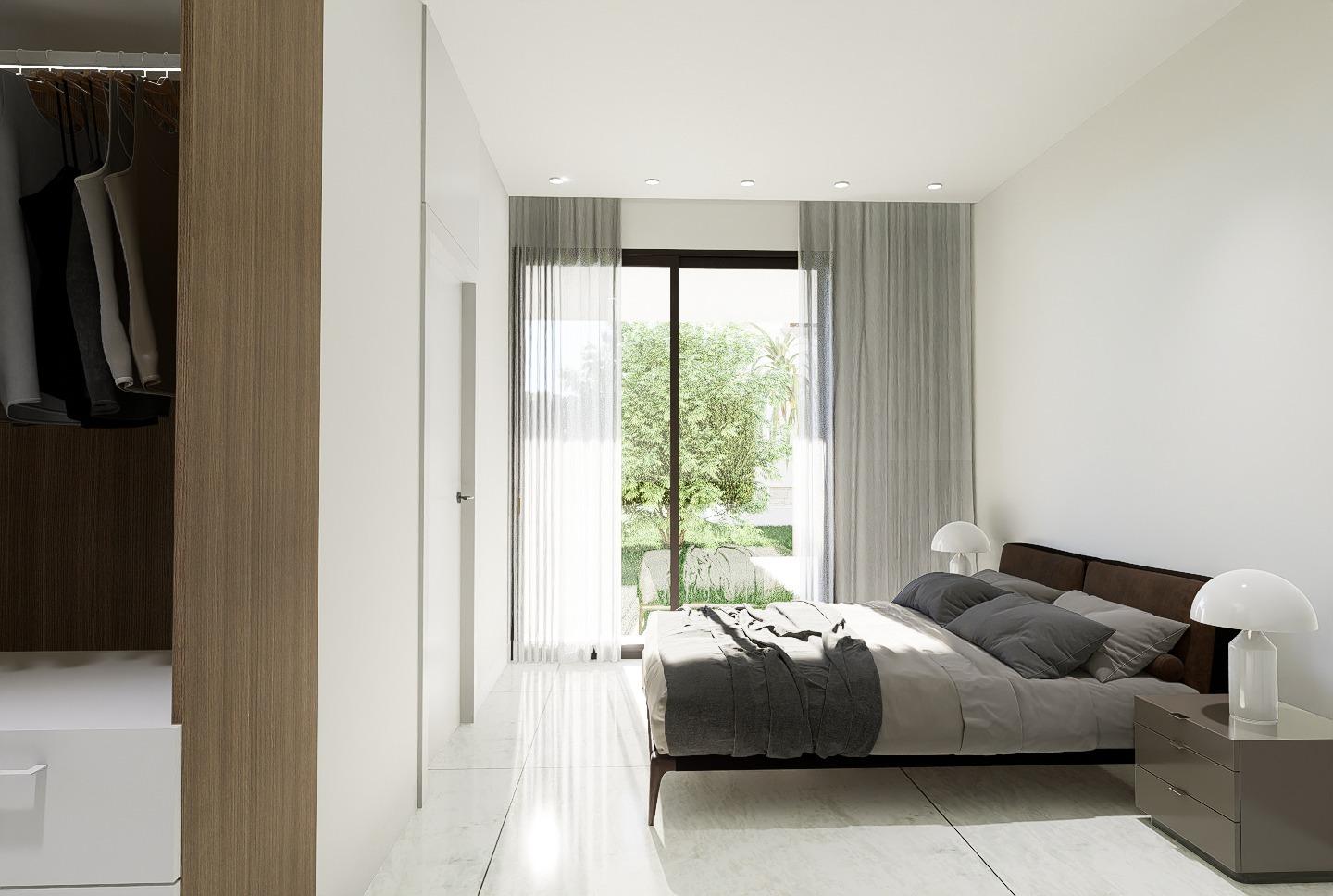Bright, modern 4-bedroom villa bedroom with sleek design and garden views in luxury new build property in La Zenia, Orihuela Costa