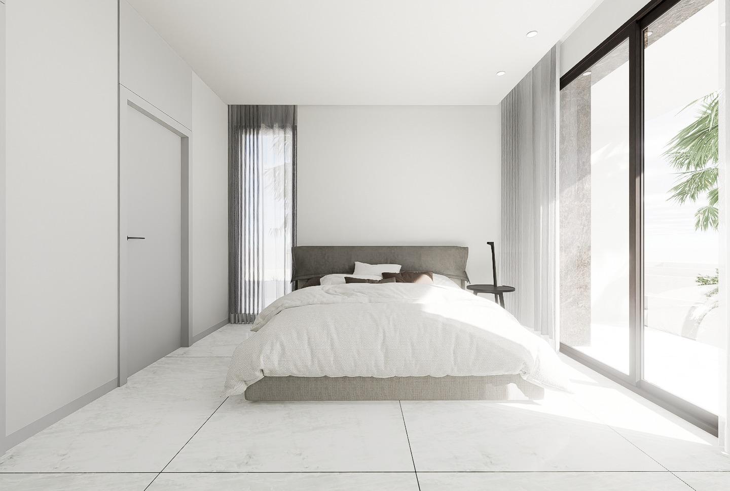 Bright, minimalist bedroom with floor-to-ceiling windows in luxury 4-bedroom villa in La Zenia, Orihuela Costa.