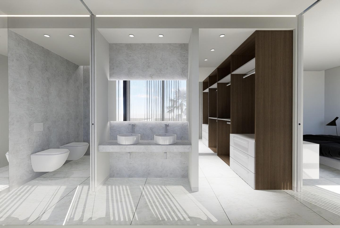 Bright, modern bathroom with sleek fixtures and walk-in closet in luxury 4-bedroom villa in La Zenia, Orihuela Costa.